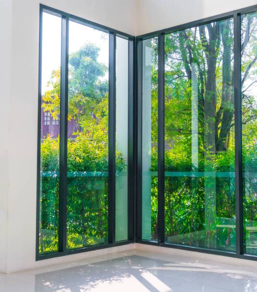 Glass window overlooking green garden