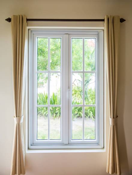 opened window with white frame and curtain